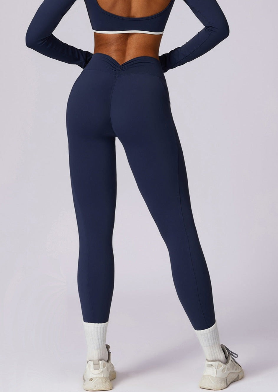 Legginsy damskie z kieszeniami granatowe tył