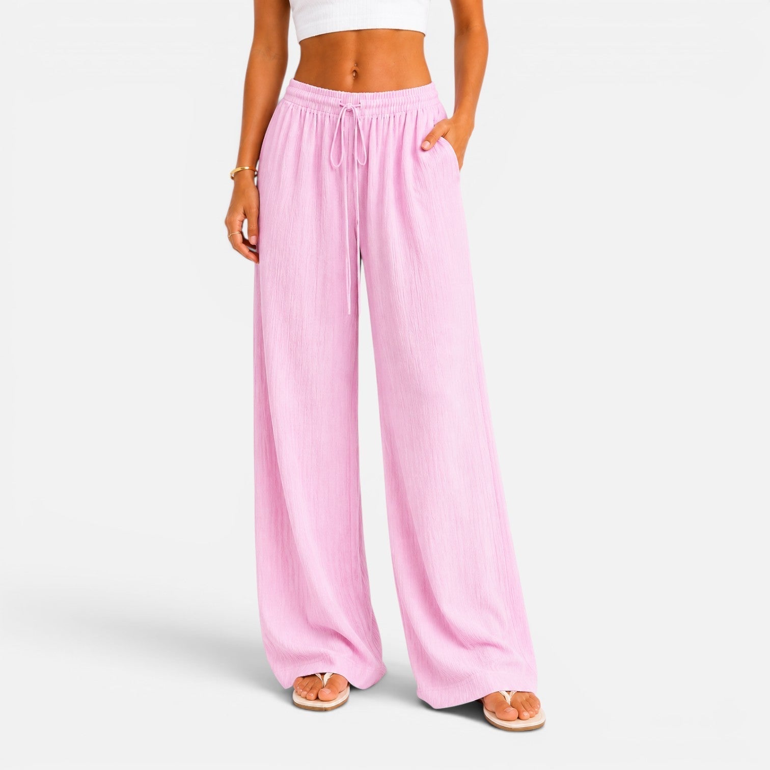 Szerokie spodnie damskie w kolorze różowym, comfort fit – Diamila Moda